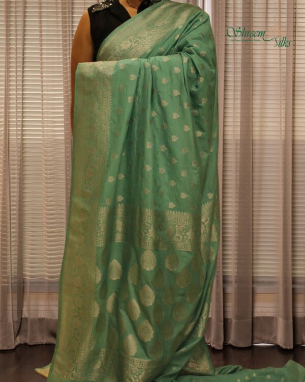 Self Embossed with Silver Zari Woven Motifs Crepe Saree